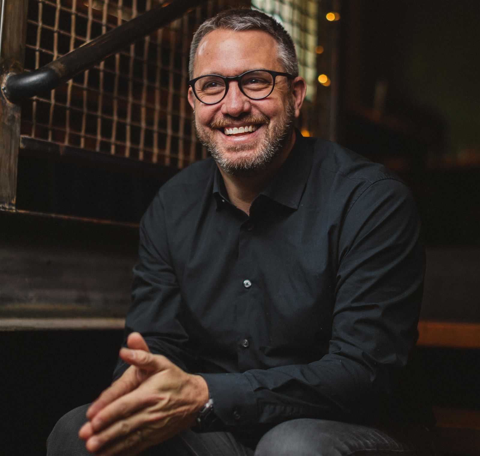 Zach Brittle, seated, in a black shirt